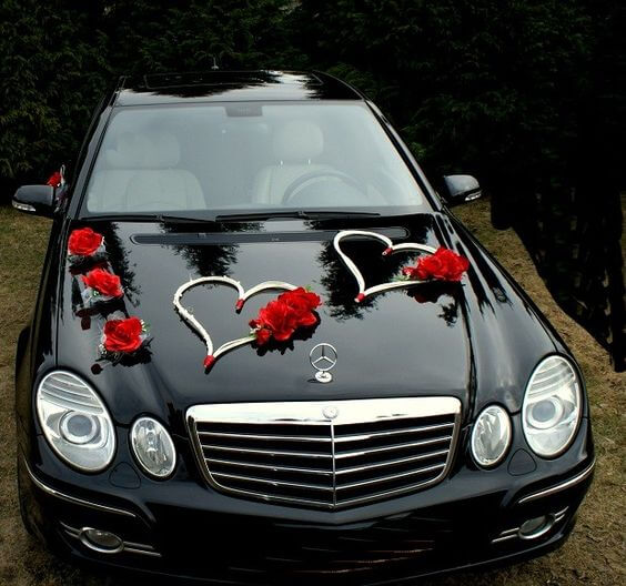 Some hearts inspired wedding car decorations for the couple madly in love